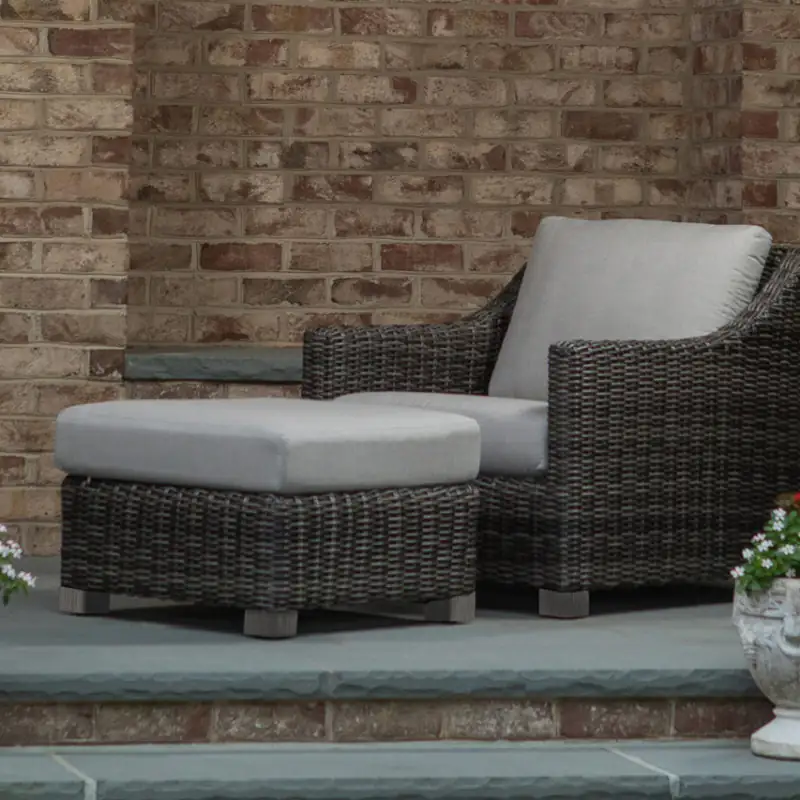 Woven lounge chair and ottoman on display